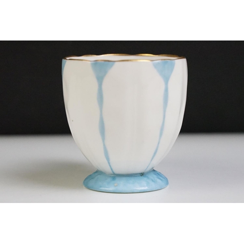 74 - Aynsley Art Deco tea cup and saucer having a butterfly formed handle, gilt rims and blue hand painte... 