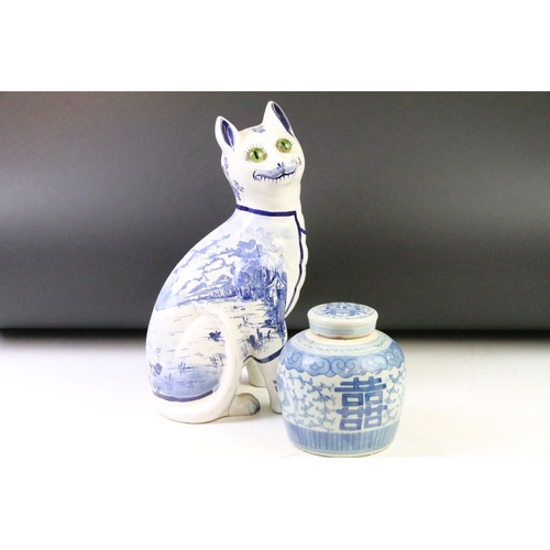 12 - Galle style Delft ware blue & white pottery model of a seated cat, with glass eyes (approx 35cm high... 