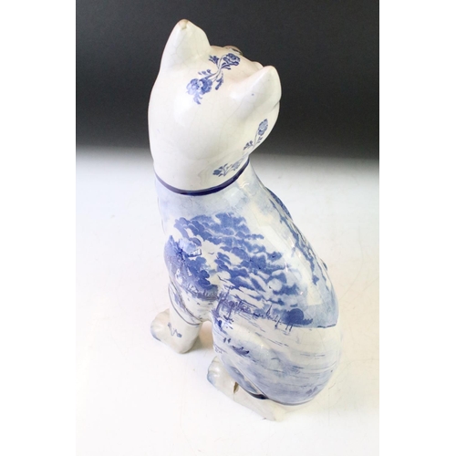 12 - Galle style Delft ware blue & white pottery model of a seated cat, with glass eyes (approx 35cm high... 