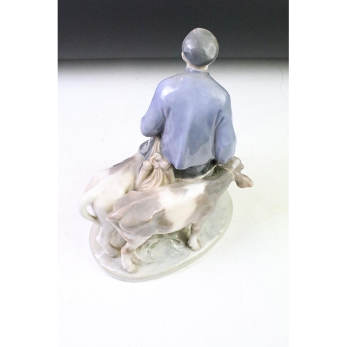 20 - Royal Copenhagen porcelain figure group in modelled as a boy with two calves, numbered 1858, approx ... 