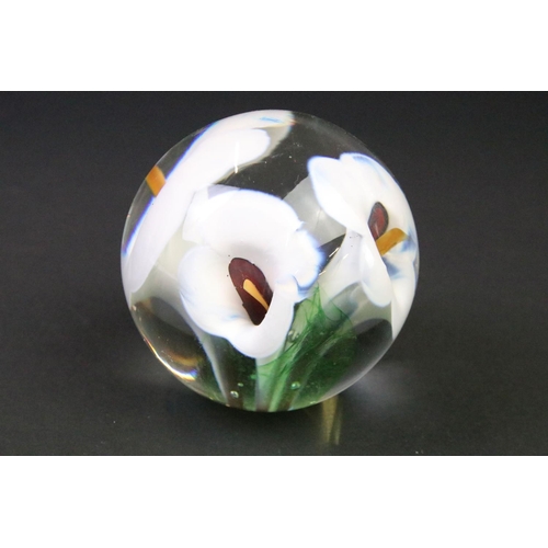 39 - Seven glass paperweights to include Caithness & Langham examples, featuring Caithness Peach Floral F... 