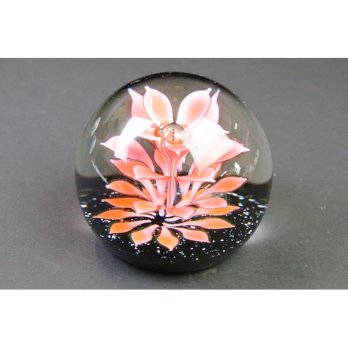 39 - Seven glass paperweights to include Caithness & Langham examples, featuring Caithness Peach Floral F... 