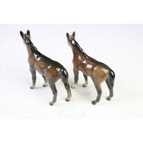 41 - Five Beswick porcelain horses / foals to include four brown gloss examples (prancing stallion, mare ... 