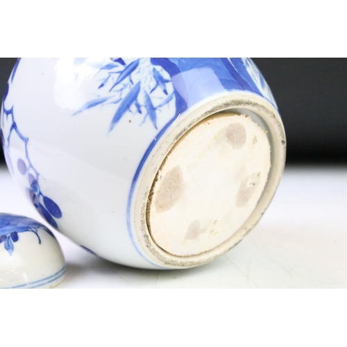 43 - Two Chinese blue & white ceramic ginger jars with covers, decorated with flowers and birds perched o... 