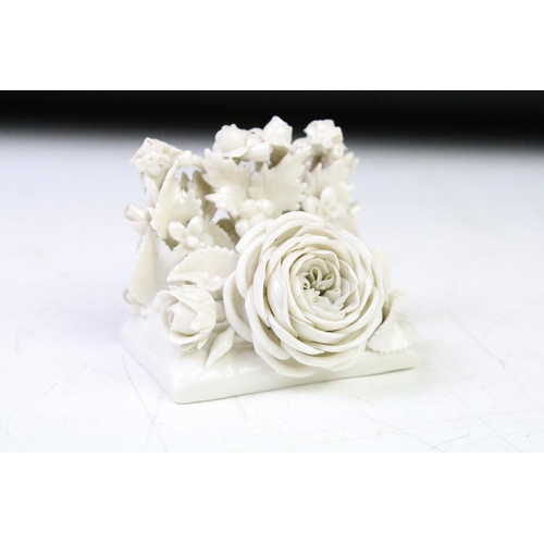 75 - Two Belleek first period white porcelain floral encrusted menu holders with rose and sunflower decor... 