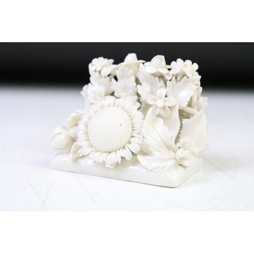 75 - Two Belleek first period white porcelain floral encrusted menu holders with rose and sunflower decor... 