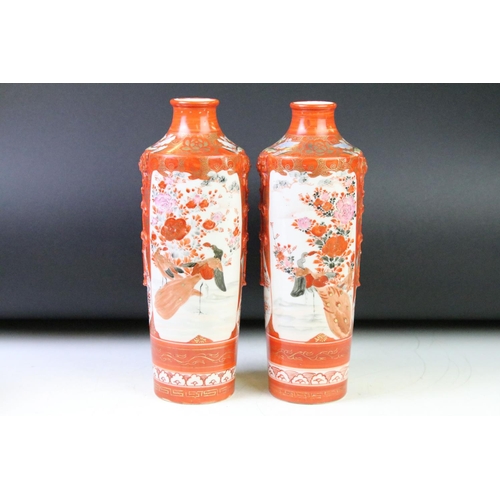 85 - Pair of Japanese Kutani vases being hand decorated with perched birds, together with a matching twin... 