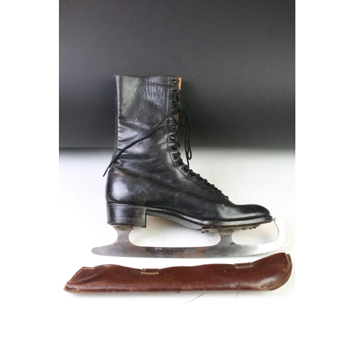 90 - Pair of Stille Swedish black leather lace up ice skates complete with fitted blade sheaths. Measures... 