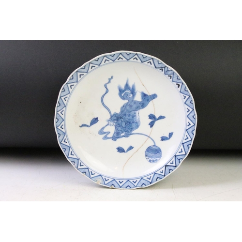 107 - 19th Century Chinese blue and white hand painted plate decorated with mythical lion to centre (four ... 