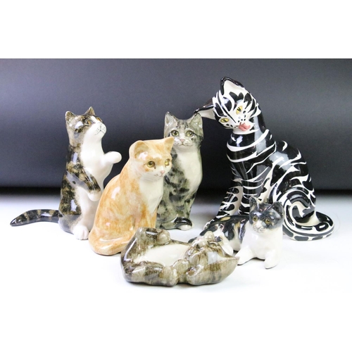 110 - Five Winstanley ceramic studio pottery cats each with yellow glass eyes, together with an Italian ce... 