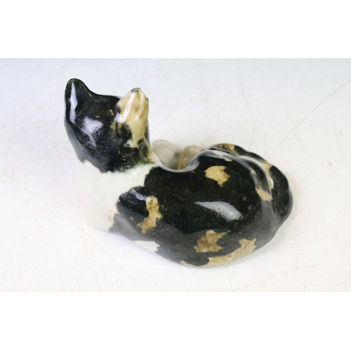 110 - Five Winstanley ceramic studio pottery cats each with yellow glass eyes, together with an Italian ce... 