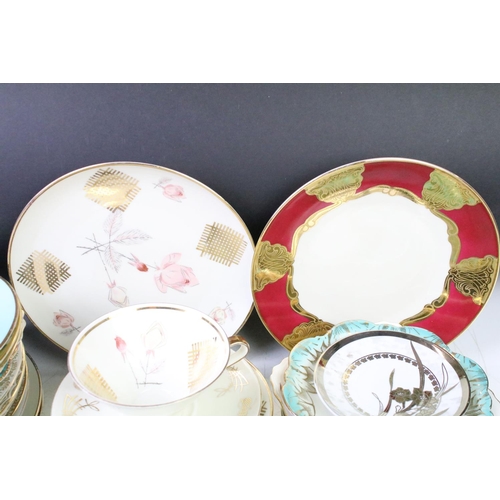 113 - Collection of assorted 20th Century cups and saucer trios, mostly by Bavarian makers in a range of s... 