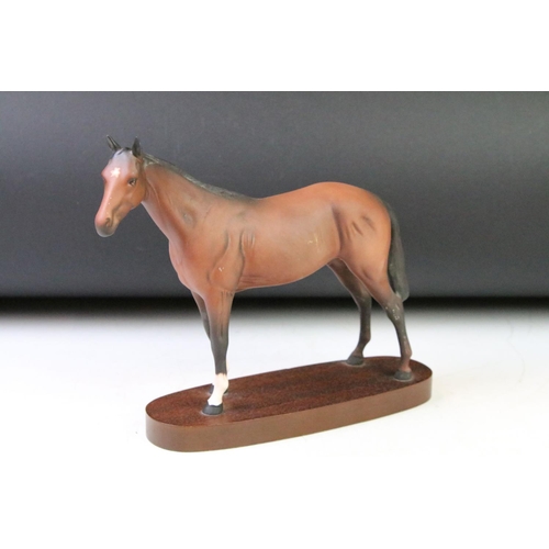 114 - Group of equestrian horse related figurines to include a Royal Doulton single brown horse on base, t... 