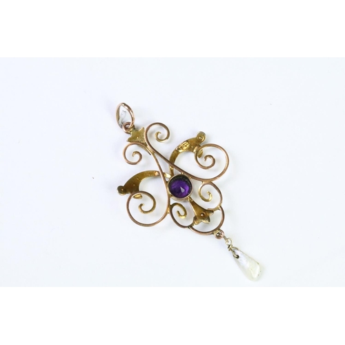 30 - A late 19th / early 20th century 9ct gold Art Nouveau pendant with amethyst and seed pearl decoratio... 