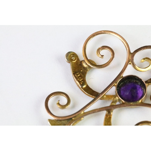 30 - A late 19th / early 20th century 9ct gold Art Nouveau pendant with amethyst and seed pearl decoratio... 