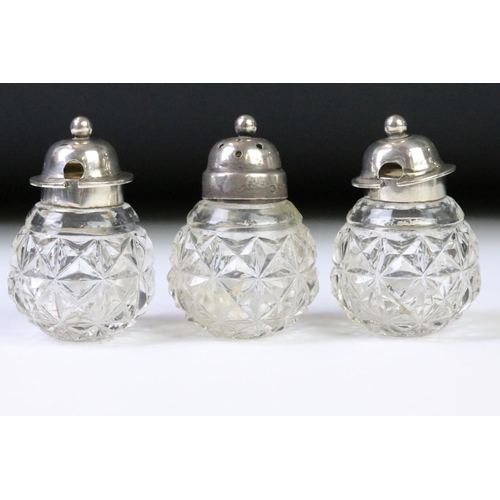 60 - A fully hallmarked sterling silver & cut glass cruet set in the form of a three leaf clover, assay m... 