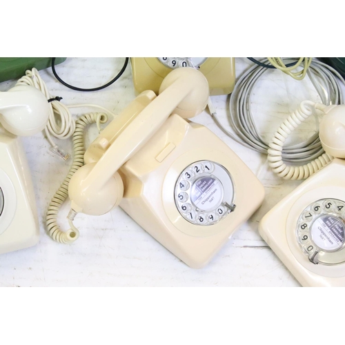 396 - Six late 20th Century plastic ring dial telephones of assorted colours with emergency directory pane... 