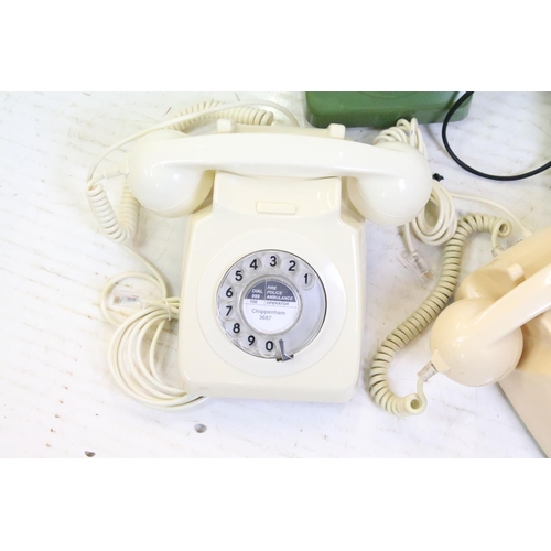 396 - Six late 20th Century plastic ring dial telephones of assorted colours with emergency directory pane... 