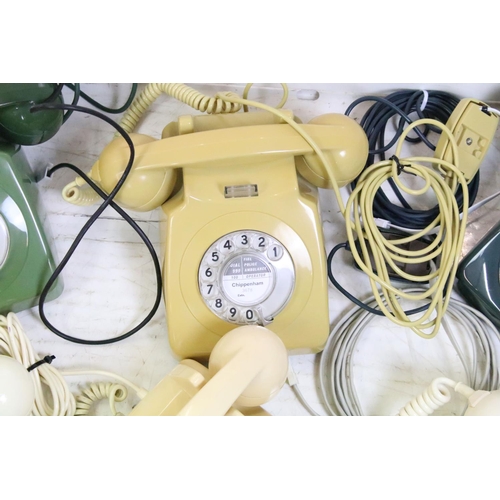 396 - Six late 20th Century plastic ring dial telephones of assorted colours with emergency directory pane... 