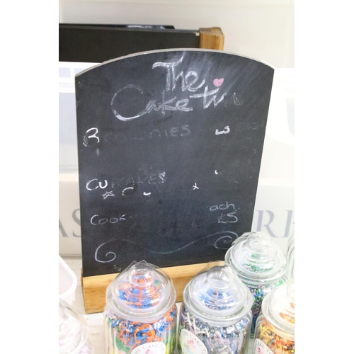 413 - Collection of cake / confectionery related items to include free standing blackboards, sweet jars, p... 