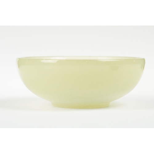 252 - Carved & polished green alabaster / hardstone bowl of circular form, diameter approx 12cm