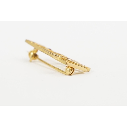 259 - A ladies hallmarked 9ct gold brooch in the form of musical notes.