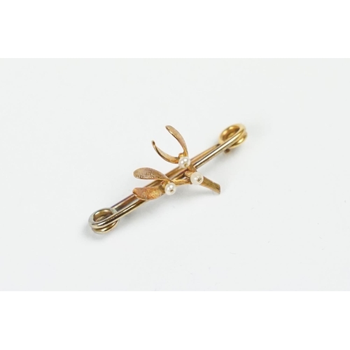 260 - A vintage bar brooch in the form of mistletoe with seed pearl decoration.