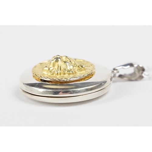 266 - Silver Gilt Photo Locket with embossed dog figure