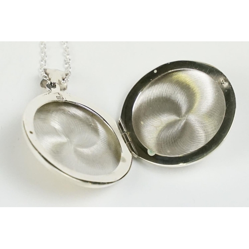 266 - Silver Gilt Photo Locket with embossed dog figure