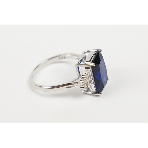 274 - A 925 sterling silver ladies dress ring of classical style with blue centre stone, marked 925 for st... 