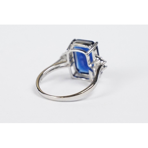 274 - A 925 sterling silver ladies dress ring of classical style with blue centre stone, marked 925 for st... 