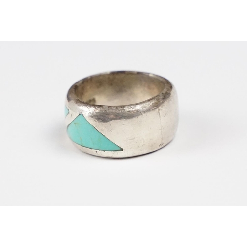 277 - A 925 sterling silver band ring set with three flush turquoise stones of triangular form, marked 925... 