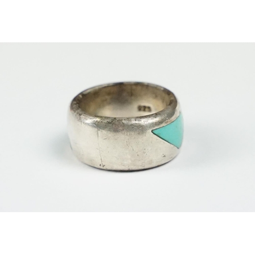 277 - A 925 sterling silver band ring set with three flush turquoise stones of triangular form, marked 925... 