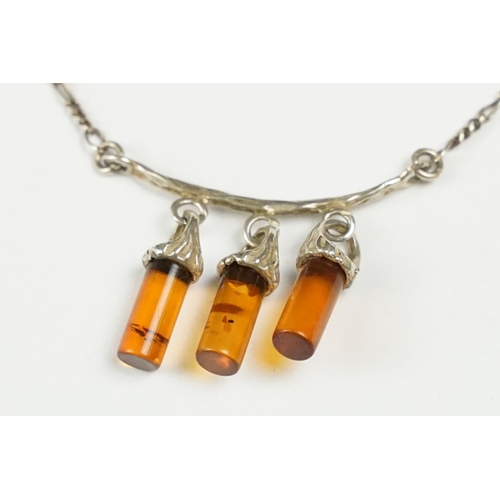 278 - A contemporary 925 sterling silver necklace with three amber style hanging drops on Figaro chain, ma... 