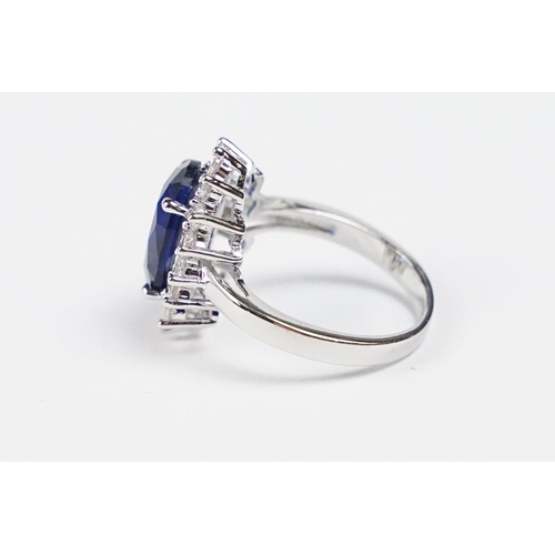 280 - A 925 sterling silver ladies dress ring of classical style with oval blue centre stone, marked 925 f... 