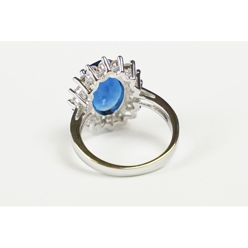 280 - A 925 sterling silver ladies dress ring of classical style with oval blue centre stone, marked 925 f... 