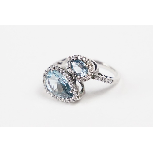 282 - A contemporary 925 sterling silver ladies dress ring set with two large light blue stones of teardro... 