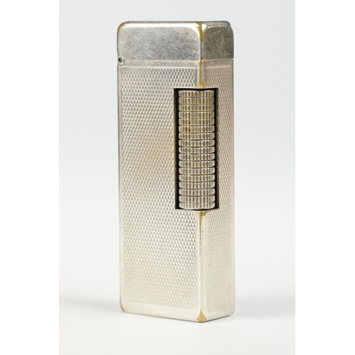 290 - A mid 20th century silver plated Dunhill pocket lighter with service reciept.