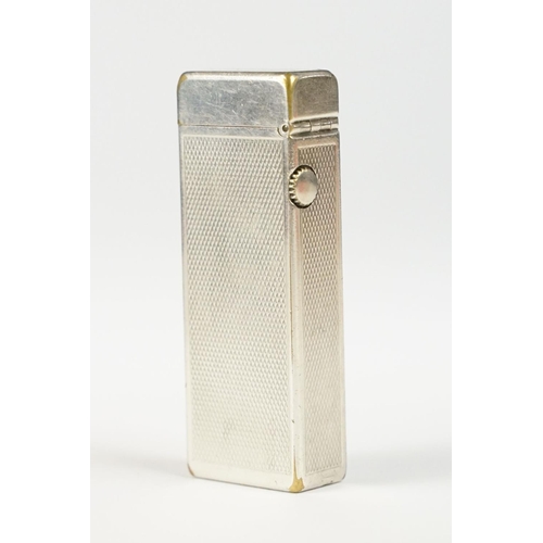 290 - A mid 20th century silver plated Dunhill pocket lighter with service reciept.