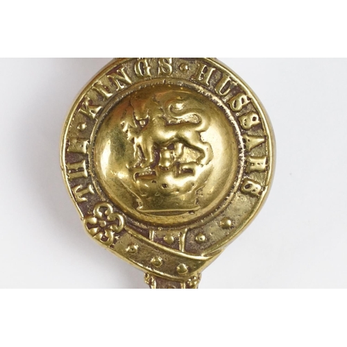 295 - A Victorian military 'The Kings Hussars' horse brass badge with twin light fixings to verso.