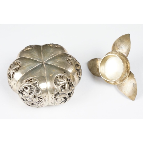 296 - A vintage white metal betal nut holder in the form of a pumpkin with ornate pierced decoration toget... 