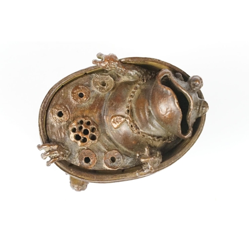 301 - A Chinese copper ornamental lucky bathing toad figural incense burner with removable top, measures a... 