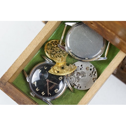 318 - A wooden watchmakers box together with contents to include wristwatches, pocket watches and parts.