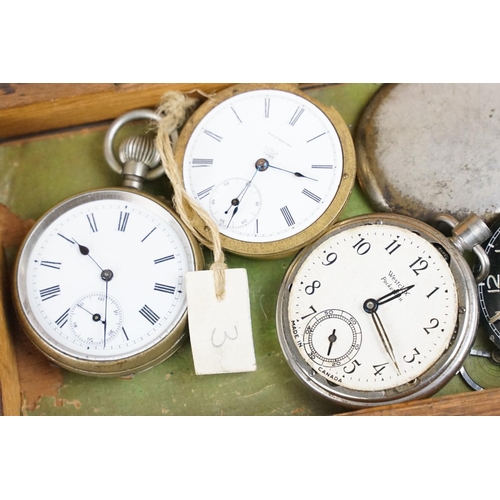 318 - A wooden watchmakers box together with contents to include wristwatches, pocket watches and parts.