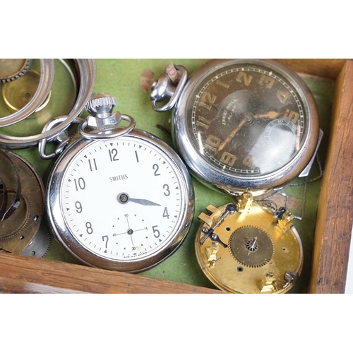 318 - A wooden watchmakers box together with contents to include wristwatches, pocket watches and parts.