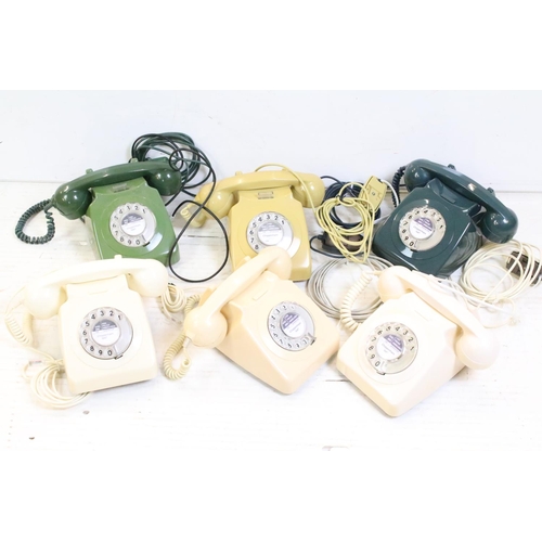 396 - Six late 20th Century plastic ring dial telephones of assorted colours with emergency directory pane... 