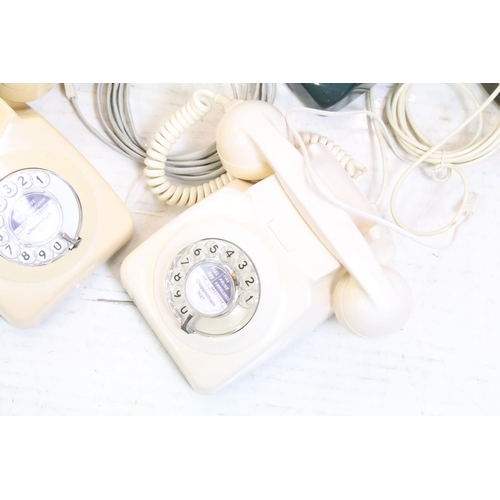 396 - Six late 20th Century plastic ring dial telephones of assorted colours with emergency directory pane... 