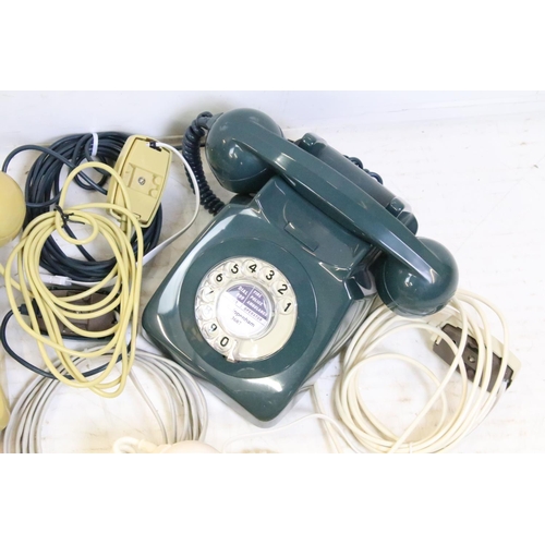 396 - Six late 20th Century plastic ring dial telephones of assorted colours with emergency directory pane... 