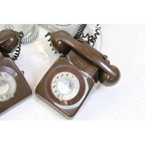 398 - Five late 20th Century plastic ring dial telephones in assorted colours. 1 box.