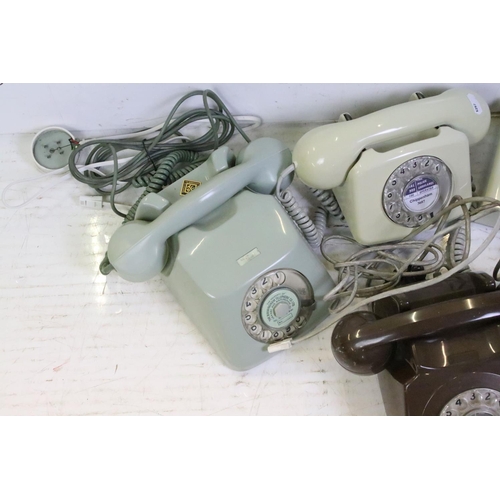 398 - Five late 20th Century plastic ring dial telephones in assorted colours. 1 box.